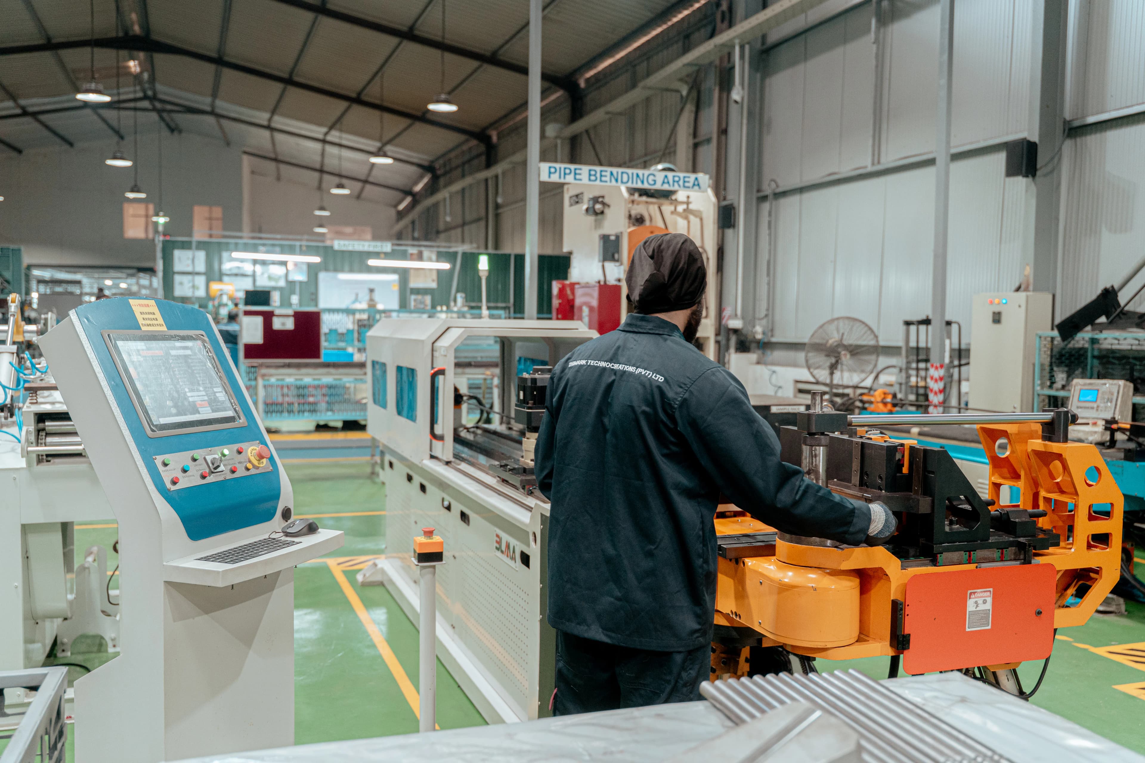Welders fabricating heavy steel frames in the Thimark workshop
