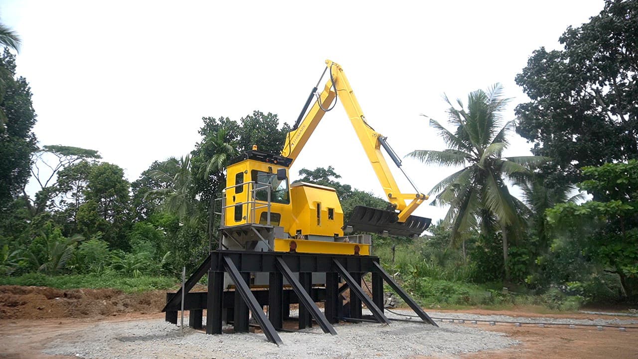 Engineers inspecting a custom industrial water-treatment machine